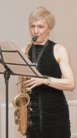 Samantha playing saxophone. Picture taken by Rtn Ken Challenger.